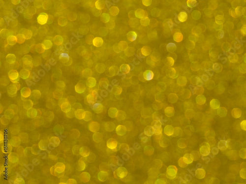 Gold. Golden sparkle background. Golden glitter background. Gold glimmer. Abstract twinkle texture. Glitter surface. Glimmer layout. Holiday layout. Golden luxury surface. Celebration background.