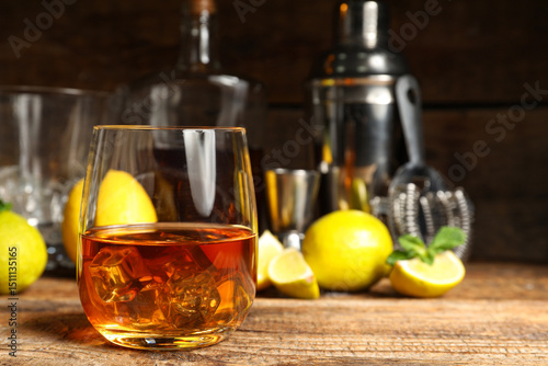 Whiskey glass with ice cube...