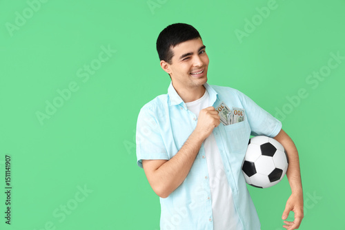 Happy young man with soccer...