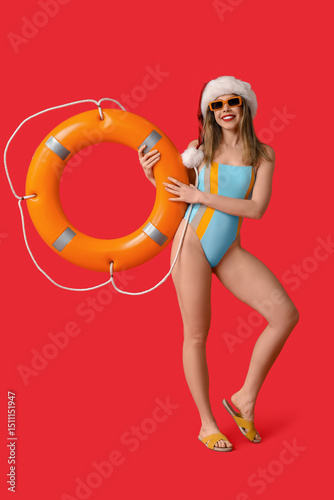 Happy young woman in swimsu...