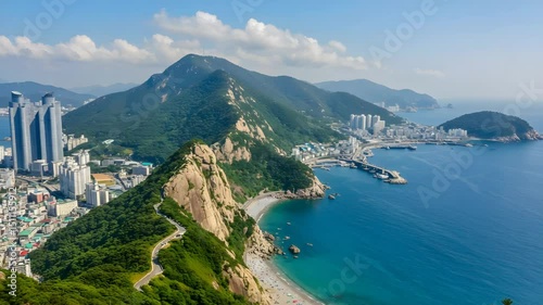 Stunning Busan Coastline Featuring Green Mountains Haeundae Beach and Vibrant City Skyline Under Clear Blue Sky