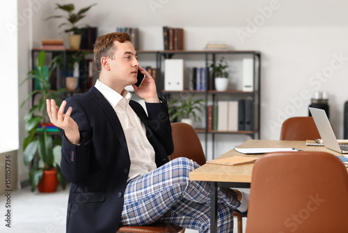 Young businessman talking b...