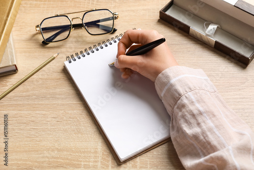 Woman writing something in ...