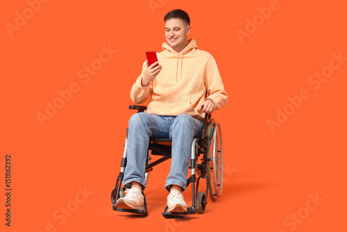 Young man in wheelchair wit...