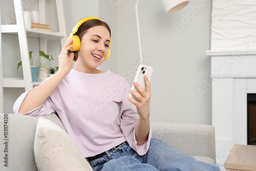 Young woman in headphones w...