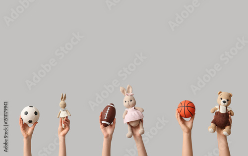 Hands holding baby toys on ...