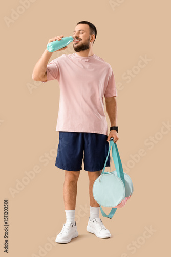 Young man with sports bag d...