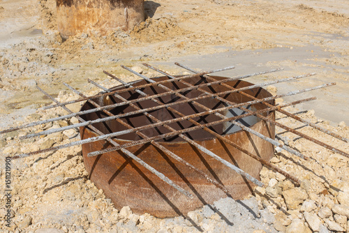 a large-diameter metal casing driven into the ground.  They are used in bridge construction, in particular, for drilling piles in difficult geological conditions, including underwater drilling