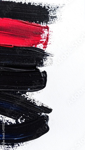 A striking abstract painting featuring bold strokes of black and vibrant red paint, creating a dynamic interplay of color and texture on the canvas.