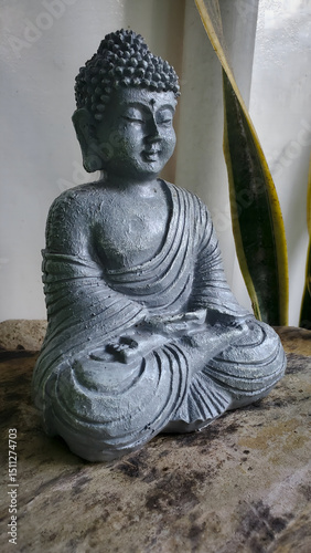 small grey clay buddha statue