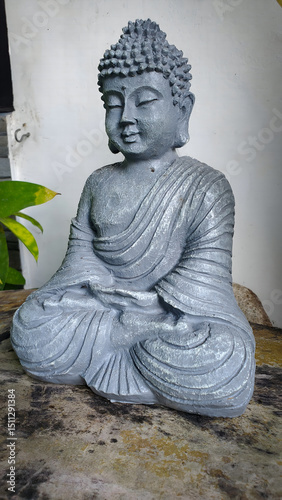 small grey clay buddha statue