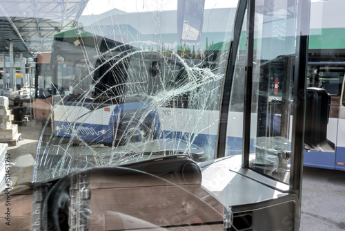 unbreakable frontal glass damaged by crash in a public transport bus