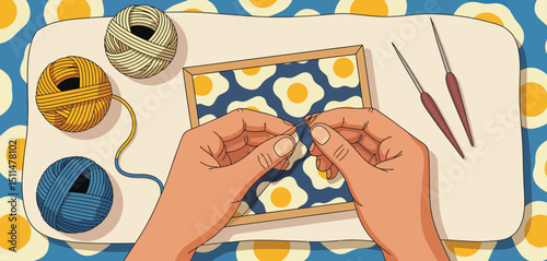 Hands embroidering a fried egg pattern on fabric