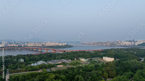 Photography Aerial view of the city of Seoul Forest with large buildings and the 
Hangang Ri
