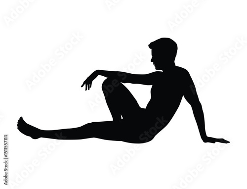 Silhouette of a man reclining on the ground with one knee up, relaxed and thoughtful in posture