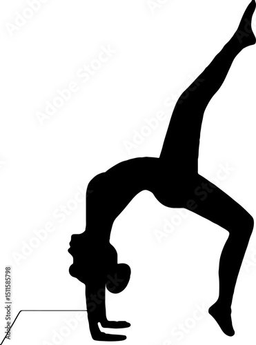 Silhouette of a woman doing a somersault and touching the floor with her hands.