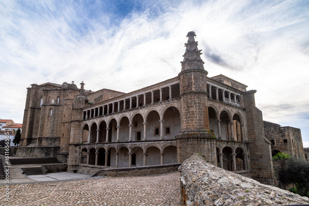 Obraz premium Majestic 15th-Century Gothic-Renaissance Convent of San Benito with Arcaded Cloister in Alcántara, Spain