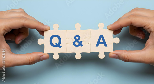 Q&A concept displayed on puzzle pieces, promoting interaction and inquiries. A close-up shot depicts two hands assembling a jigsaw puzzle with 