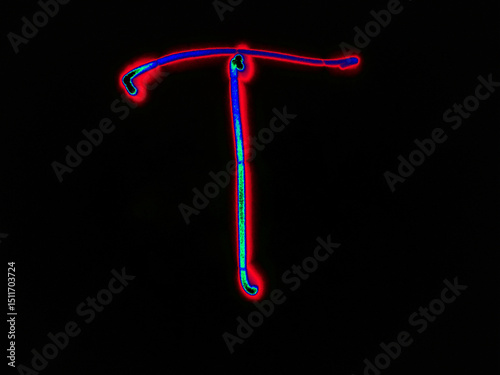 Glowing English letter T. On a black background with colored neon lines, a letter of the English alphabet is written by hand. The letter glows pink-red, creating a green-blue halo around it.