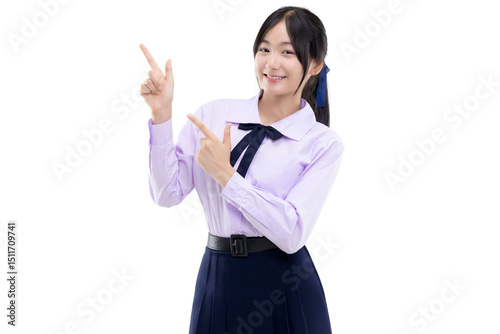 Happy pretty Asian student girl in school uniform pointing finger up isolated on transparent background, PNG file format.