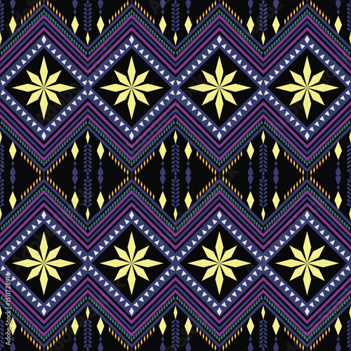 A central, multi-colored diamond motif featuring a sun-like design is displayed on a black band, framed by repeating purple and pink diamond patterns.