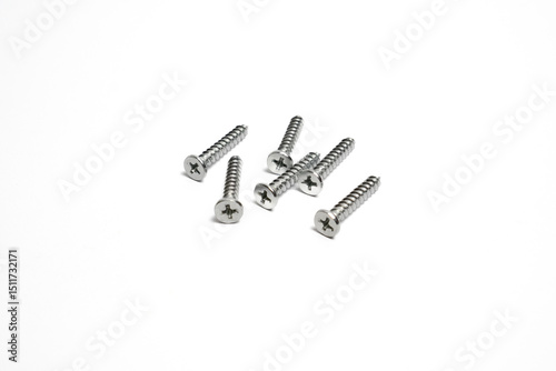 Several screws with pointed tips and Phillips head isolated.