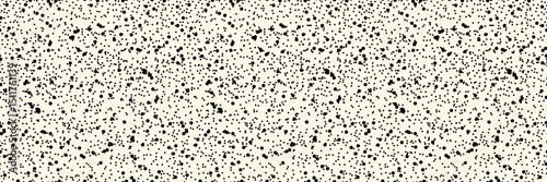 Paper fleck seamless pattern. Black speckled gritty texture, beige organic background. Vector simple backdrop for scrapbook, wrapping, wallpaper.