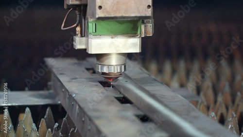 Close-Up of CNC Laser Cutting Steel Sheet with Sparks in Dark Workshop