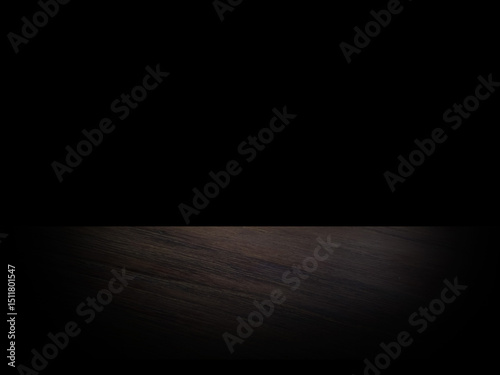 Green wooden table on black background. Stage and low light for displaying merchandise.