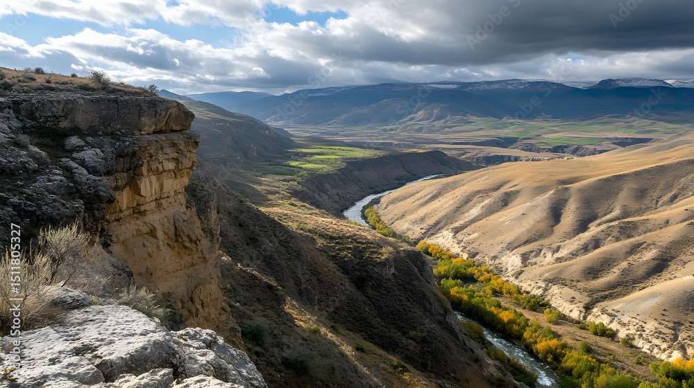 Obraz premium A dramatic canyon landscape with a winding river