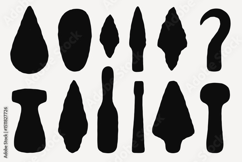 Collection of ancient stone tools and arrowheads on white background