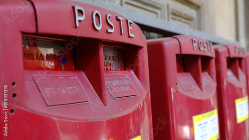 The iconic red postal boxes stand out, making them perfect for efficient mail collection in a vibrant urban environment