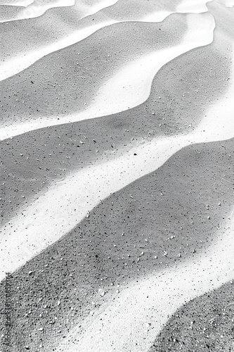 Detailed image of fine sand with subtle wave-like textures, emphasizing natural, undisturbed patterns