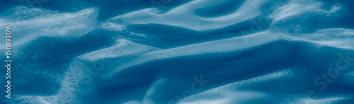 Obraz na płótnie Lightly frayed edges and delicate net structures define this blue lace macro