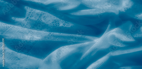 Cuadro en lienzo A gracefully draped blue textile with frayed edges and fine mesh detailing