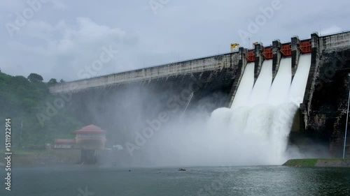 A large dam is draining because of heavy rain. The amount of water in the dam is too high.