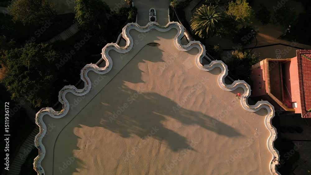 aerial view of parc guell, a landmark tourist attraction in Barcelona, Spain at sunrise, empty