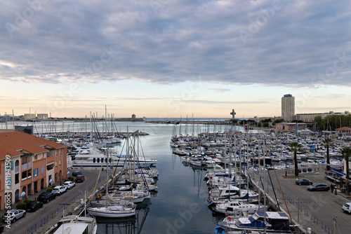 Marina with sailing ships of Port de Bouc at dawn with sunrise in spring in France