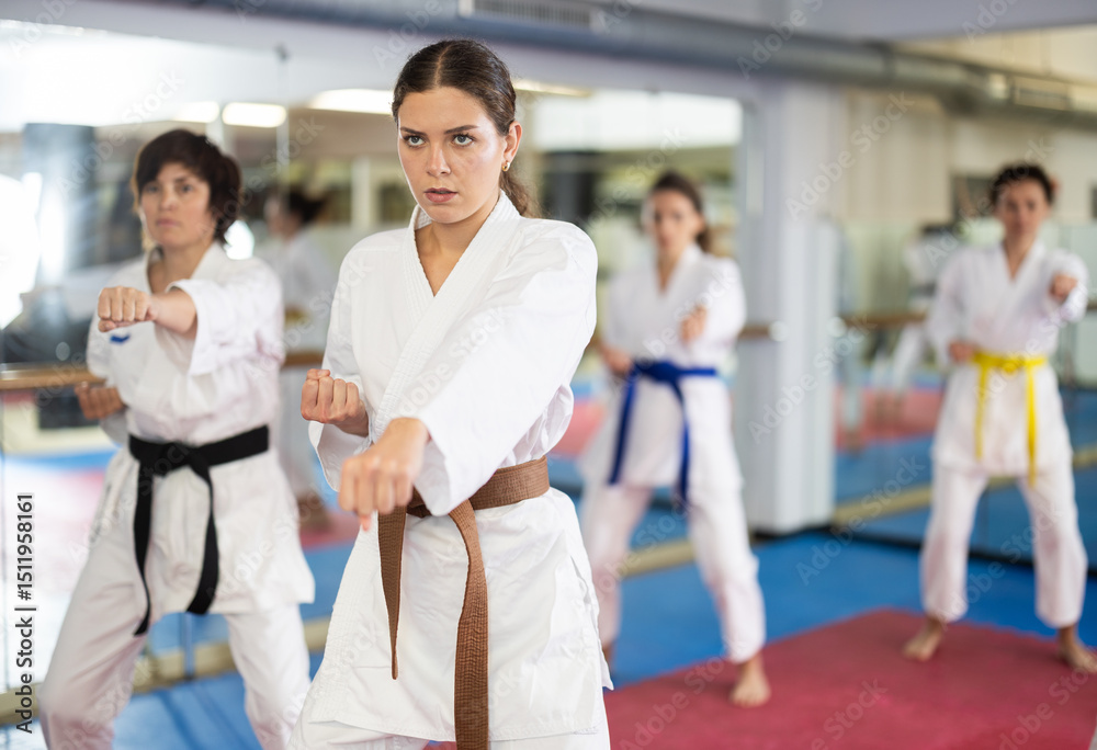 Kata karate female classes movements , fighting techniques to prepare them for competitions. Oriental martial arts, training and obtaining black belt. Sport in everyday life of city dweller.. Kata karate female classes movements , fighting techniques to prepare them for competitions. Oriental martial arts, training and obtaining black belt. Sport in everyday life of city dweller..