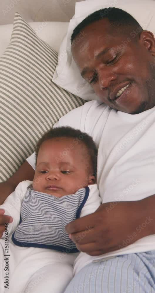 Loving Father and Baby Son Bonding in Bed: A Playful Morning at Home Loving Father and Baby Son Bonding in Bed: A Playful Morning at Home