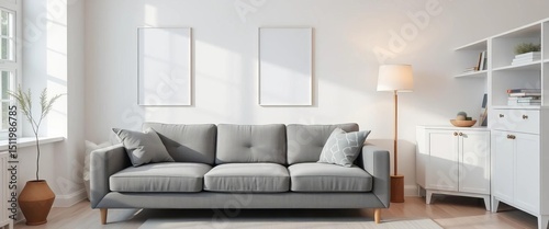 Grey fabric settee adjacent to white cabinet in minimalist living room; simple posters on wall,  decor,  airy