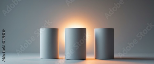 Three White Cylinders with Warm Light on a Light Background, Abstract Presentation.