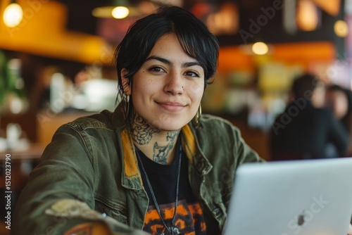 Casual portrait of a Non binary hispanic transgender mid Tomboy using laptop computer in a modern cafeteria restaurant. Androgynous authentic identity. Generative AI