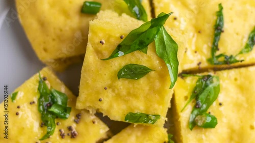 fresh and tasty dhokla steamed, fermented rice and chickpea cake 