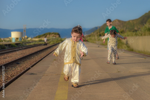 Little Arab child Smiling and happy, beautiful Arab child in beautiful traditional dress, Child in traditional Algerian dress, boy in Moroccan Tunisian Libyan dress, North African Arabs in Algeria.