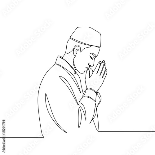 Man praying in traditional attire with closed eyes and folded hands