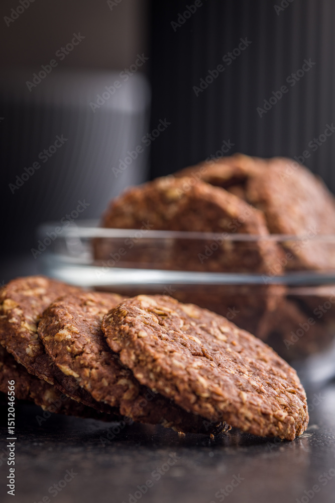 Fototapeta premium Sweet oatmeal cookies on black table.