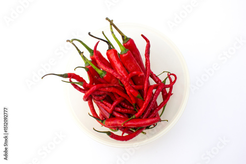 Fototapeta Naklejka Na Ścianę i Meble -  Fresh red chillies and red curly chillies isolated on white background.