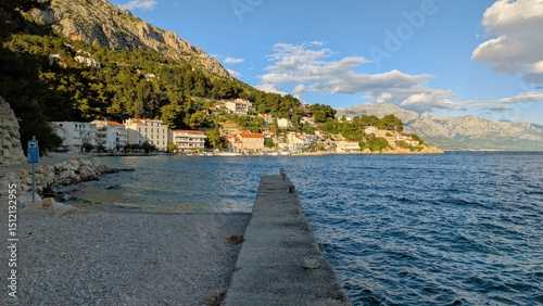 Fototapeta Naklejka Na Ścianę i Meble -  Beautiful coastal landscape scenery, Mimice village near Split city with mountain Biokovo in background, Crroatia, travel and nature