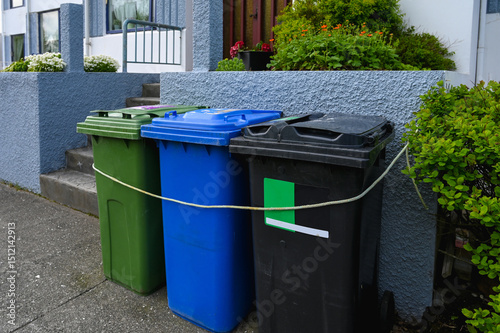 Colorful Recycling Bins for Waste Sorting Outside Residential House. Eco-Friendly Waste Separation System in Iceland.